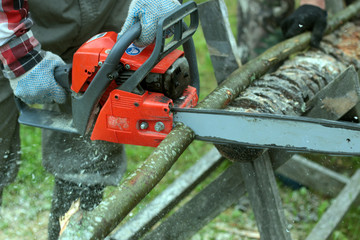 Naklejka premium chop wood Chainsaw