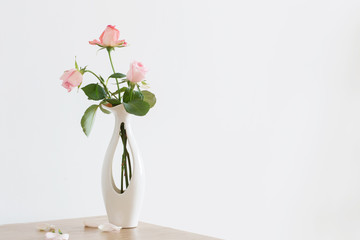 still life of pink rose in ceramic vase