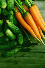 fresh crop of carrots and cucumbers