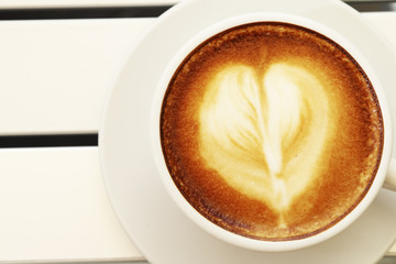 Hot mocha coffee decorated on white background, latte art.