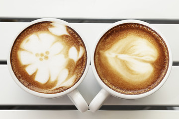 Hot mocha coffee decorated on white background, latte art.