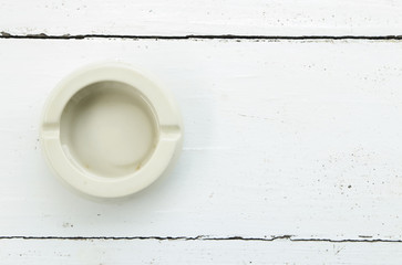 Cup decorated on white wooden background for background.