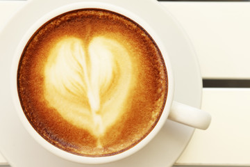 Hot mocha coffee decorated on white background, latte art.