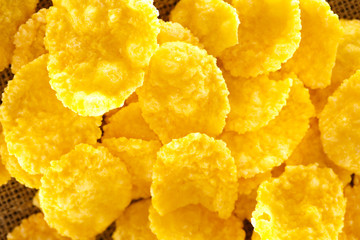 Wooden spoon and corn flakes