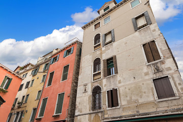 A narrow, old street in Venice, Italy. Venetian historical archi