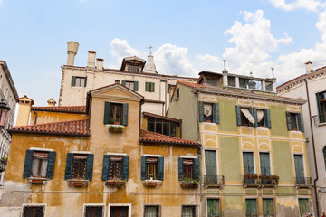 The walls of the old picturesque houses in Venice