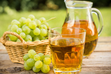 Grape juice in the glass and pitcher