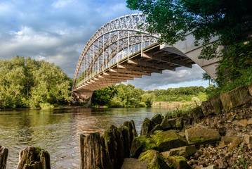 Wylam Railway Bridge crosses the River Tyne at Hagg Bank, Northumberland, UK. Taken from the riverbank. © shmooj