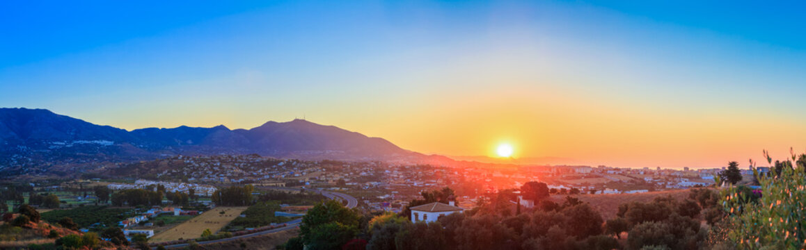 Fototapeta Mountain And Sunset at Mijas, Spain. Mountains on Yellow Sunrise