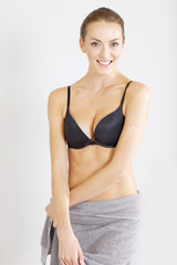 Fototapeta premium Woman with towel drapped around her