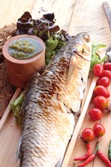 Grilled fish of salt with spicy sauce delicious.