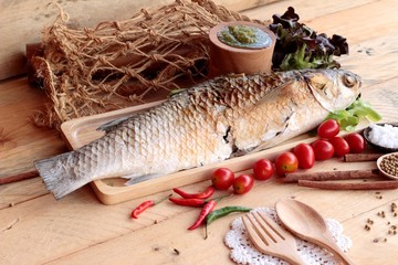 Grilled fish of salt with spicy sauce delicious.