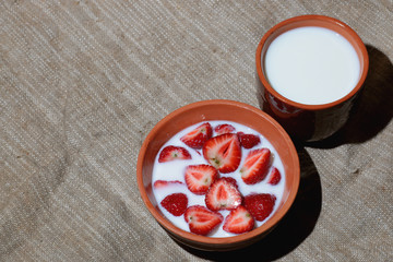 Strawberry close-up bowl with milk