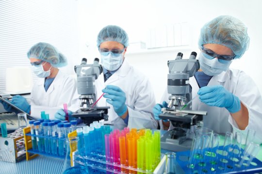 Group of medical doctors in laboratory.