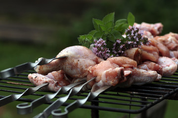 Chicken on the grill to cook