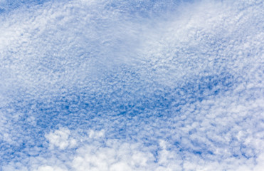 Sky background with the fluffy white clouds
