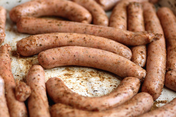 preparing sausages on fire