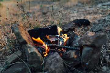 coffee cooked over a campfire on  nature