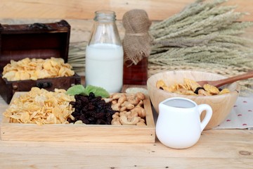 Corn flake with currant dried fruit ,cashew nuts and milk.