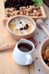Corn flake with currant dried fruit ,cashew nuts and milk.