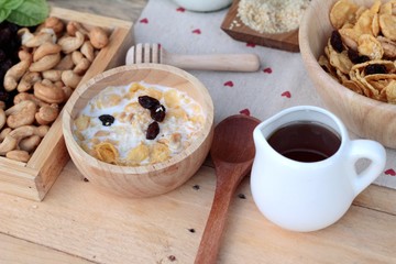 Corn flake with currant dried fruit ,cashew nuts and milk.