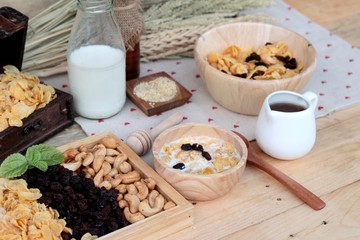 Corn flake with currant dried fruit ,cashew nuts and milk.