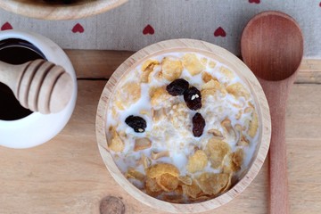 Corn flake with currant dried fruit ,cashew nuts and milk.