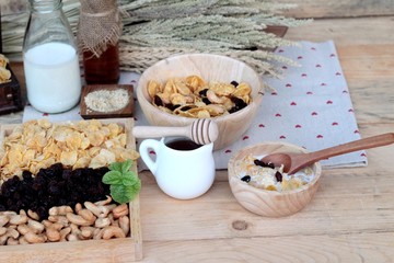 Corn flake with currant dried fruit ,cashew nuts and milk.