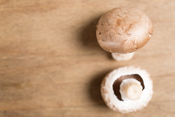 Selection of fresh raw mushrooms on a wooden kitchen work surface