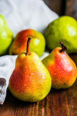 Pears on wooden background