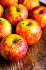 Colorful apples on wooden background