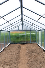 Fototapeta premium The greenhouse polycarbonate with a gable roof