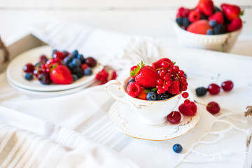 Mix of fresh berries in a cup of tea