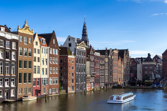 A view of the Damrak canal, near the Amsterdam Central Station, Netherlands