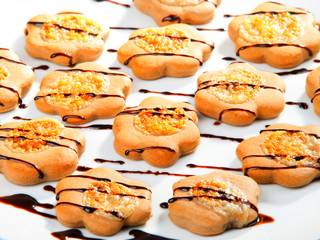 Obraz na płótnie Canvas Cookies with chocolate toppling