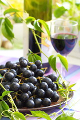 Red grapes and wine