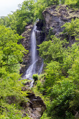 Waterfall in the summer mountains