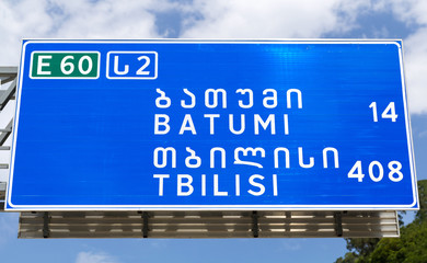 Obraz premium Road sign at the border of Georgia and Turkey