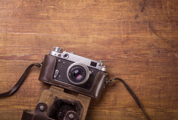 Retro camera on wood table