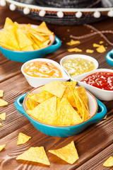 Plate of nachos with different dips