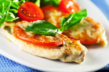 Chicken baked with mozzarella and tomatos