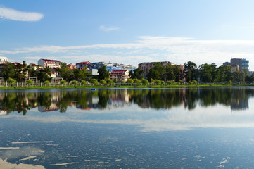 Obraz premium Houses reflected in the water of Lake Nuri. Batumi. Georgia