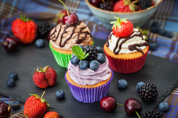 Set of different delicious cupcakes
