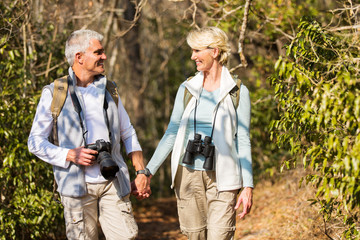 mature couple hiking in mountain