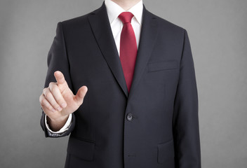Businessman pointing or touching something 