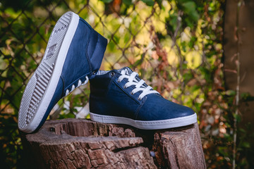 Men's shoes, sneakers on nature
