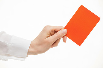 Female hand showing a red card