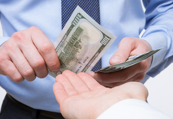 Human hands exchanging money