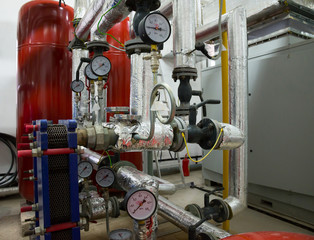 Place in a large industrial boiler room. 