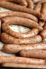 preparing sausages on fire